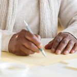 Black woman writing letter