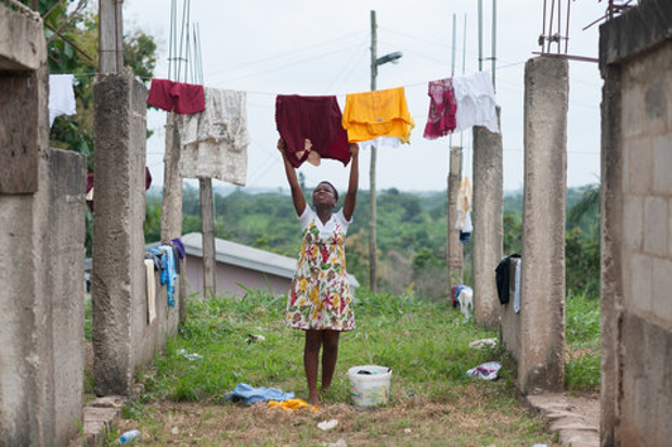 An unfinished school in suburban Kumasi, Ghana, instead serves as a clothesline. Inflation soared in Ghana this summer.Credit Nancy Borowick