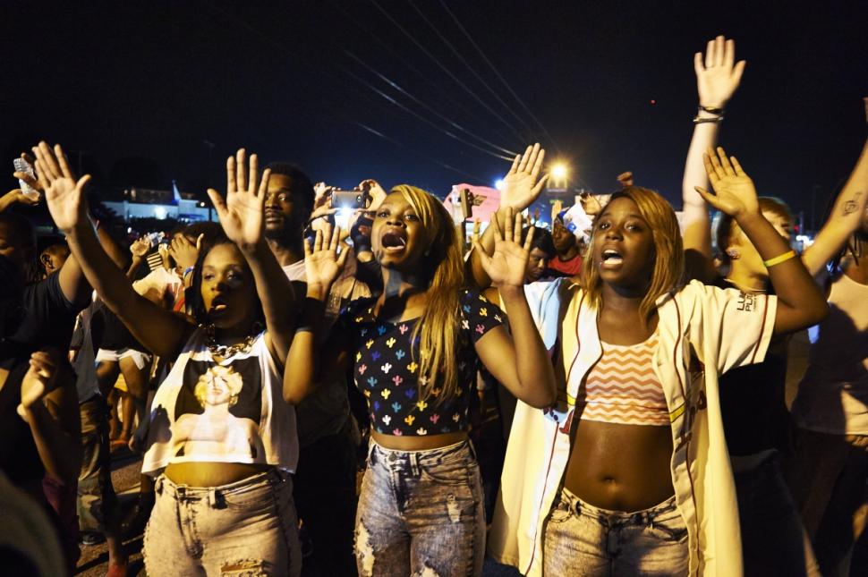 Demonstrators Protest white cop killings of Black youth.