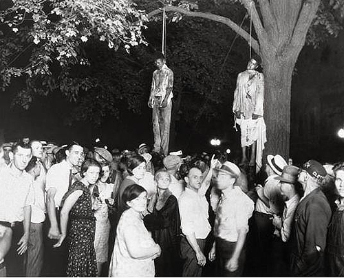 Historical Archive: Black men lynched by  white terrorists with many whites people in attendance.