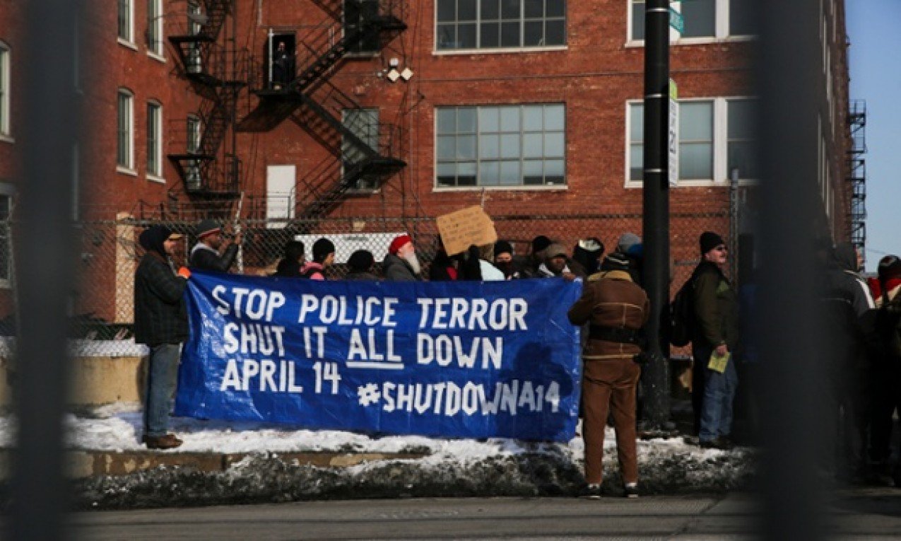 Protestors stand outside Homan Square in a demonstration against police terrorism.