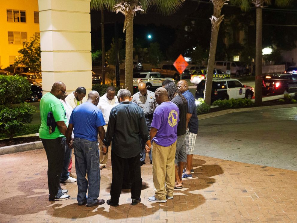 Members of the African Methodist Episcopal Church gather to pray and mourn for those who died in the carnage.