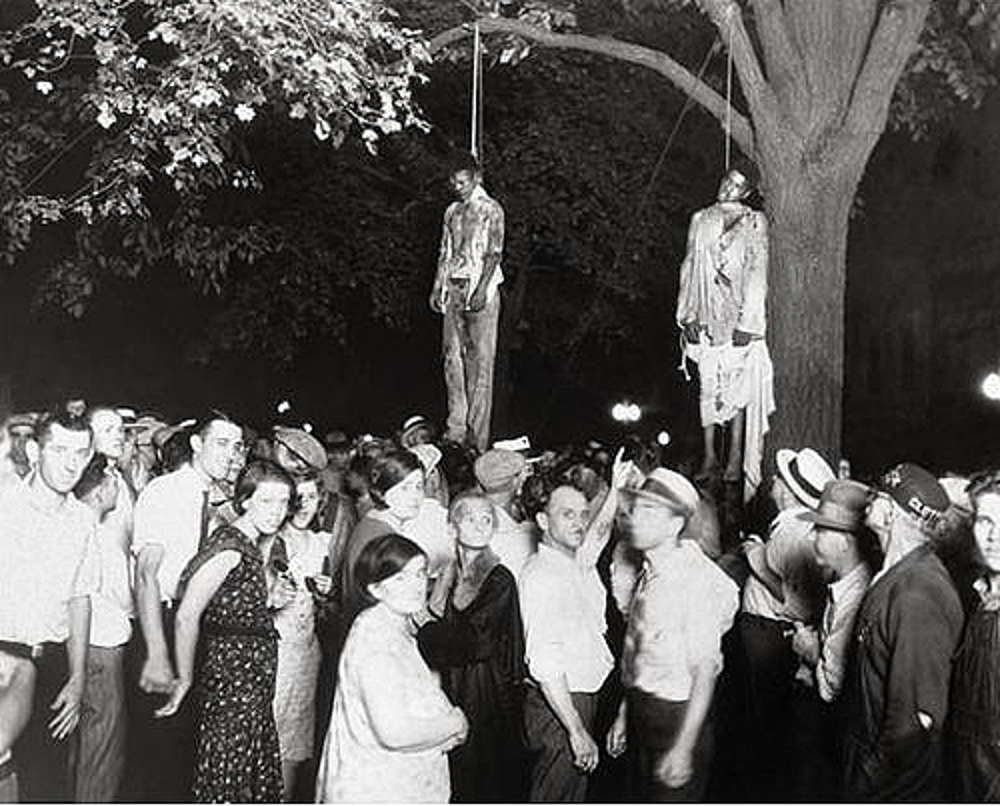 Historical Archive: Black men lynched by white terrorists with many whites people in attendance.