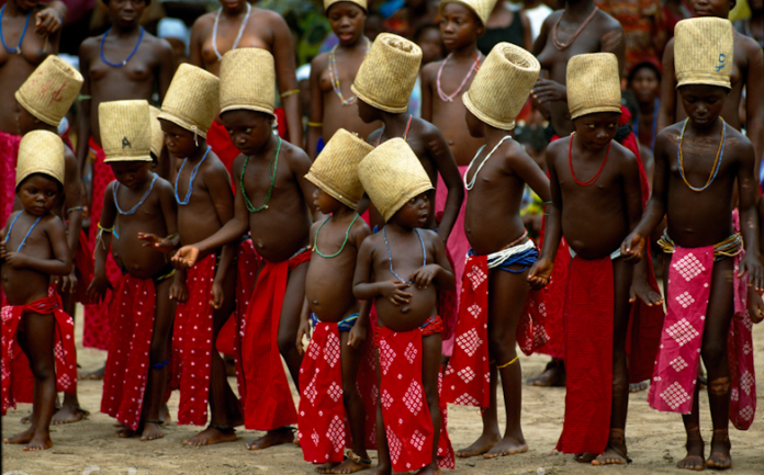 Young girls in Ghana performing a rite of passage dance.